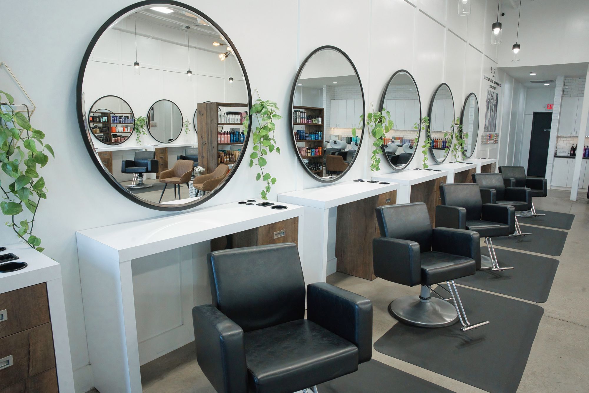 Modern salon with circular mirrors.