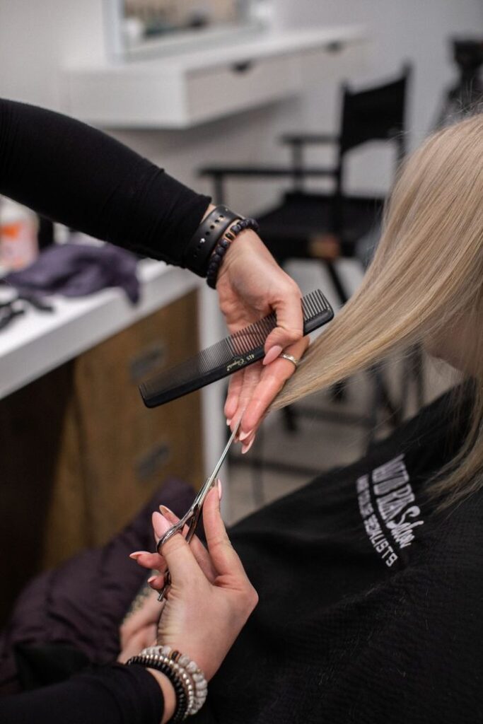 Haircut in progress at salon.